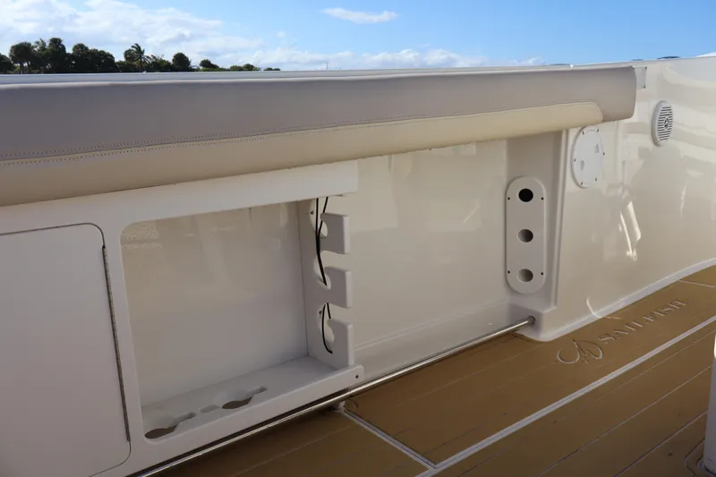  Yacht Photos Pics 2017 Sailfish 320 CC boat interior with storage compartment and cushioned seating.