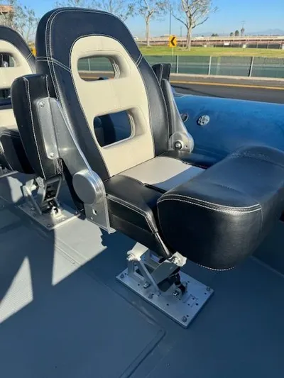  Yacht Photos Pics 2022 Allmand 31 RIB boat seat with black and beige upholstery.
