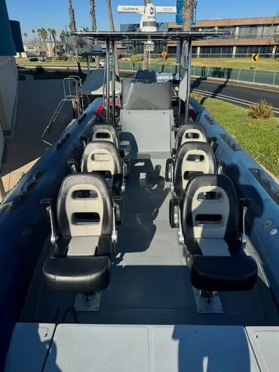  Yacht Photos Pics 2022 Allmand 31 RIB boat with multiple seats, docked outdoors.