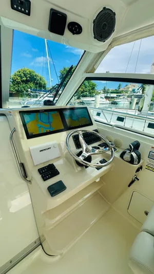  Yacht Photos Pics 2018 Boston Whaler 345 Conquest helm with dual screens and steering wheel.