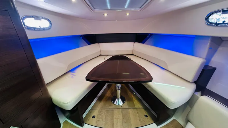  Yacht Photos Pics 2018 Boston Whaler 345 Conquest cabin with modern seating and ambient lighting.