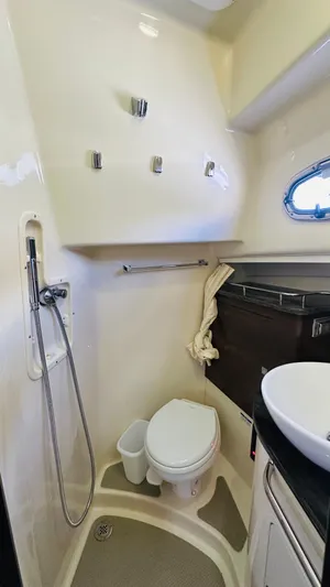  Yacht Photos Pics 2018 Boston Whaler 345 Conquest bathroom with shower, toilet, and sink.