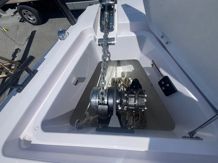  Yacht Photos Pics Anchor compartment of 2022 Axopar 28 CABIN boat with chain and winch.