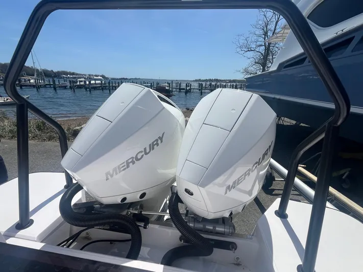  Yacht Photos Pics Twin Mercury outboard engines on a 2022 Axopar 28 CABIN boat by the waterfront.
