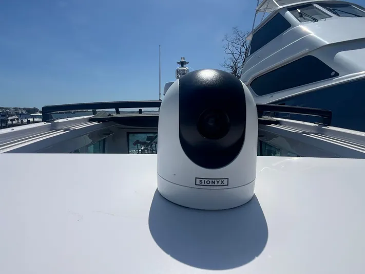  Yacht Photos Pics SIONYX camera on 2022 Axopar 28 CABIN boat deck under clear sky.