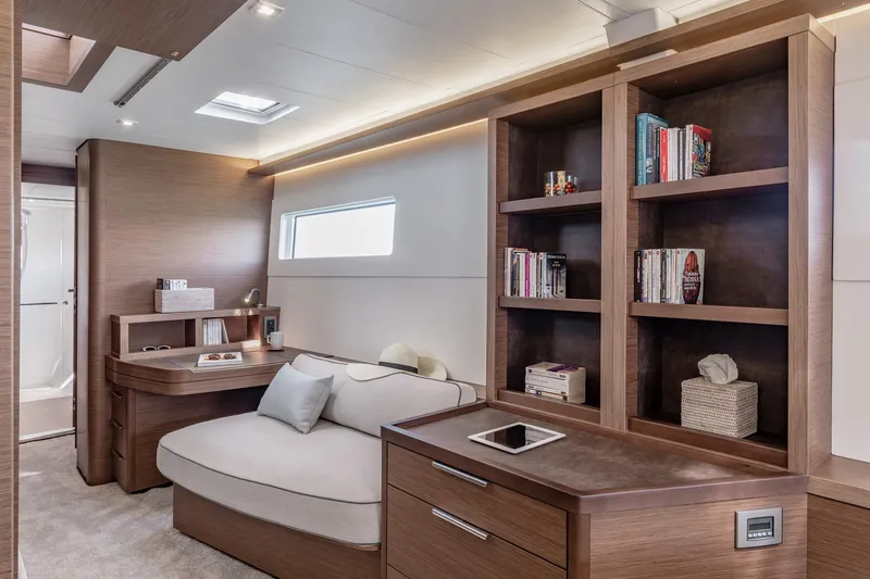  Yacht Photos Pics Luxurious interior of 2022 Lagoon 46 yacht with modern wood furnishings and cozy seating area.