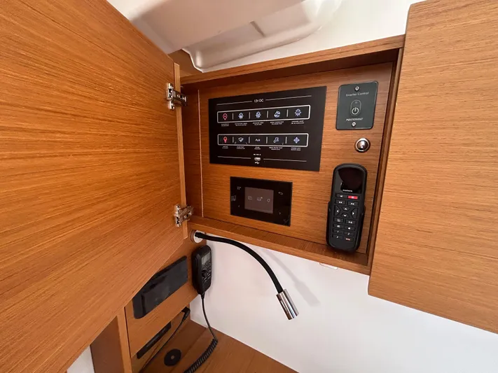  Yacht Photos Pics Control panel inside 2023 Beneteau First 44 yacht, featuring communication and navigation equipment.