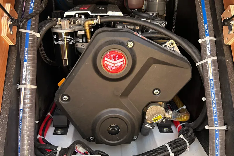  Yacht Photos Pics Engine compartment of a 2023 Beneteau First 44 sailboat, showcasing mechanical components and wiring.