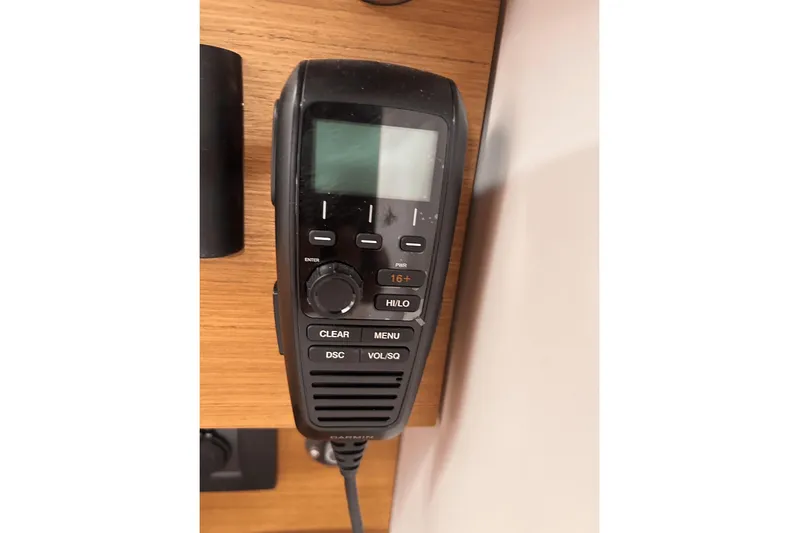  Yacht Photos Pics VHF radio on 2024 Beneteau First 44 yacht, mounted on wooden panel.
