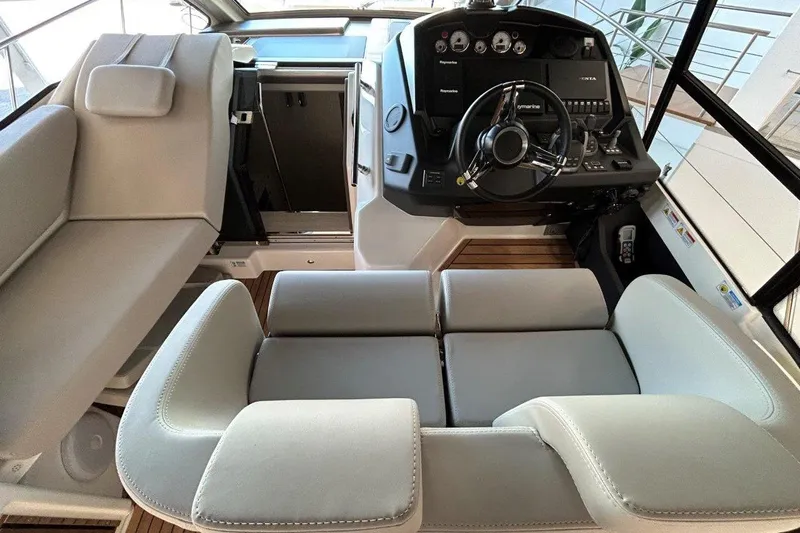  Yacht Photos Pics 2025 Cranchi M44HT yacht interior with modern helm and luxurious seating.