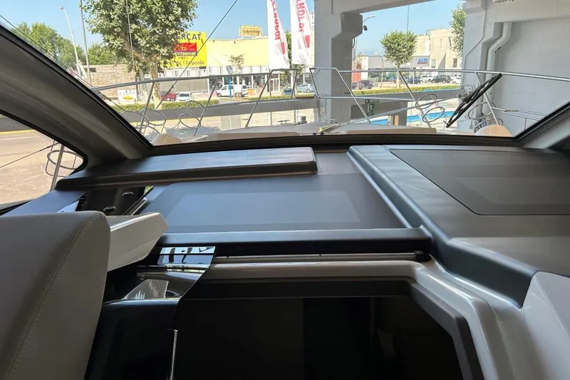 Yacht Photos Pics Interior view of 2025 Cranchi M44HT yacht, showcasing sleek dashboard design.