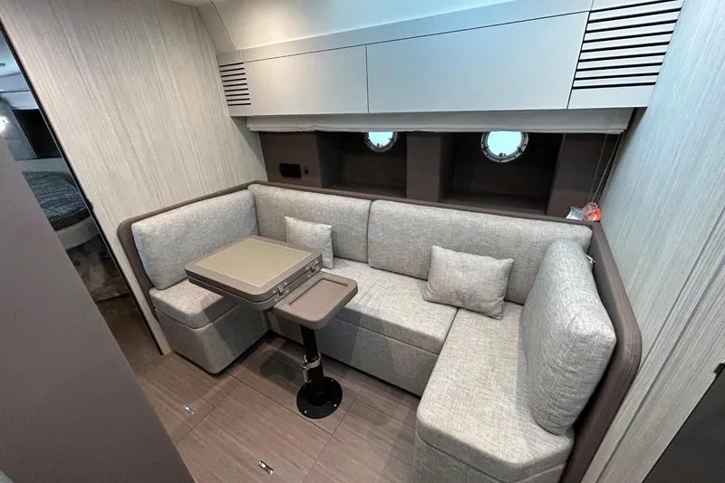 Yacht Photos Pics Luxurious interior of 2025 Cranchi M44HT yacht with modern seating and table.