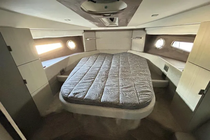  Yacht Photos Pics Luxurious cabin interior of 2025 Cranchi M44HT yacht with elegant bedding.