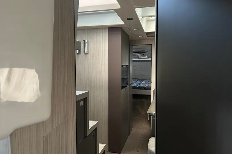  Yacht Photos Pics Interior of 2025 Cranchi M44HT yacht, featuring modern design and cozy sleeping area.