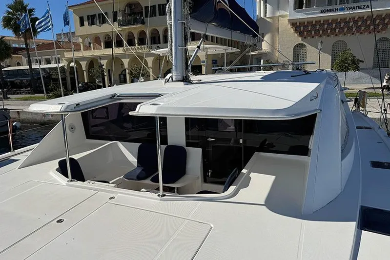  Yacht Photos Pics 2017 Leopard 48 yacht docked, showcasing sleek design and spacious deck area.