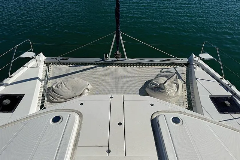  Yacht Photos Pics 2017 Leopard 48 catamaran deck with netting over calm water.