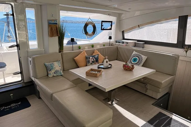  Yacht Photos Pics Luxurious interior of 2017 Leopard 48 yacht with elegant seating and ocean view.
