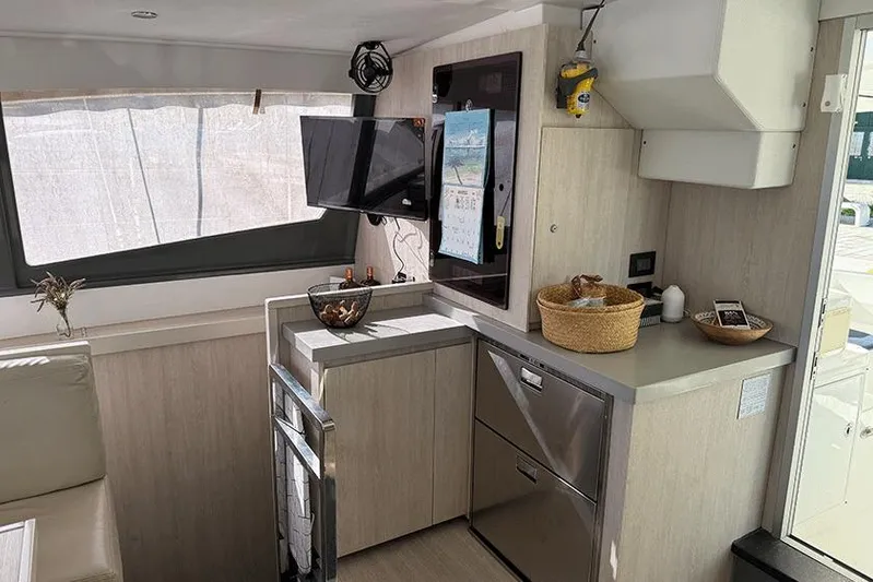  Yacht Photos Pics Interior of 2017 Leopard 48 yacht with modern kitchen and entertainment area.