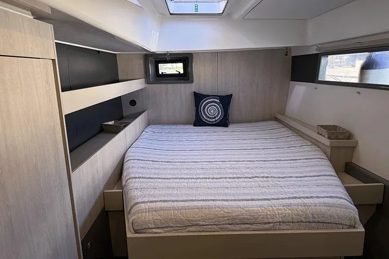  Yacht Photos Pics Luxurious cabin interior of a 2017 Leopard 48 yacht with a cozy bed.