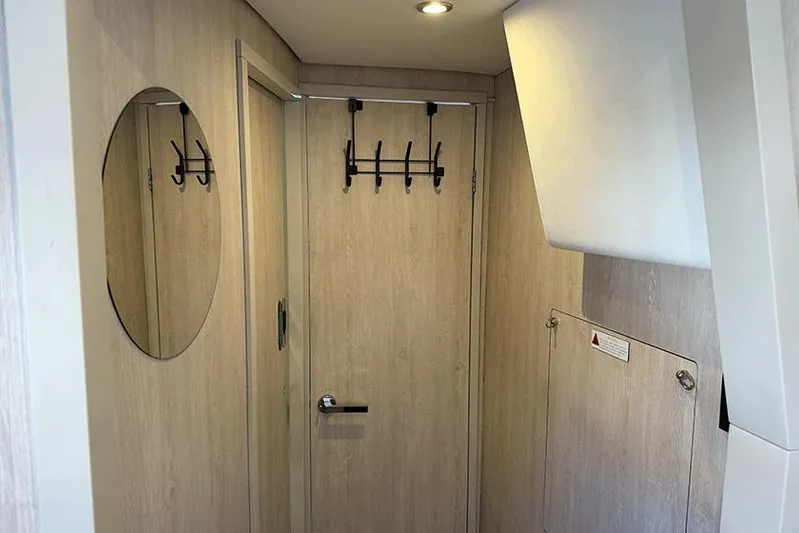  Yacht Photos Pics Interior of a 2017 Leopard 48 yacht with wooden paneling and modern fixtures.