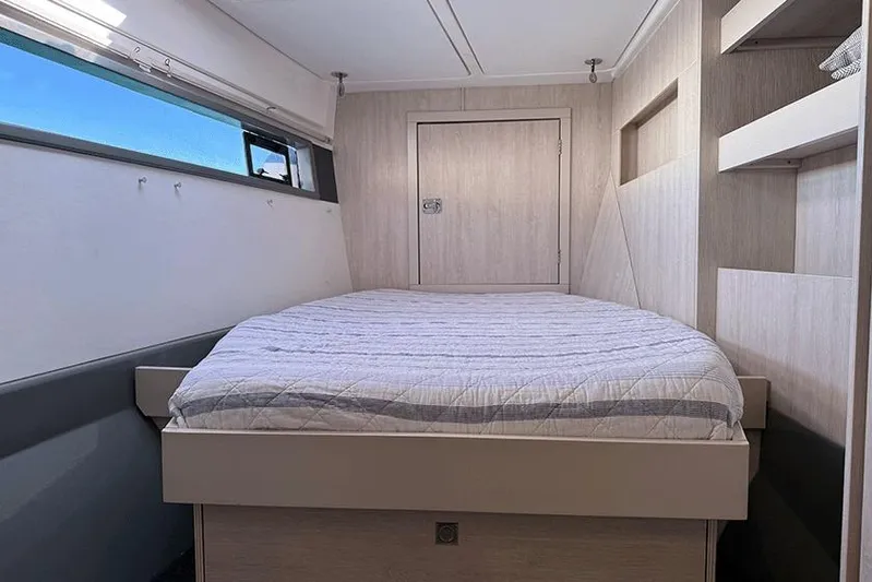  Yacht Photos Pics Interior cabin of 2017 Leopard 48 yacht with bed and window view.