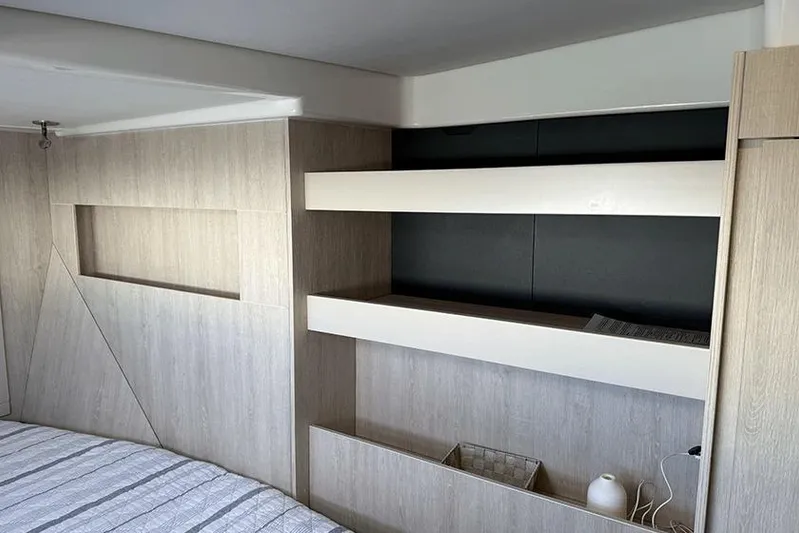  Yacht Photos Pics Interior of a 2017 Leopard 48 yacht with modern wooden shelving and minimalist design.