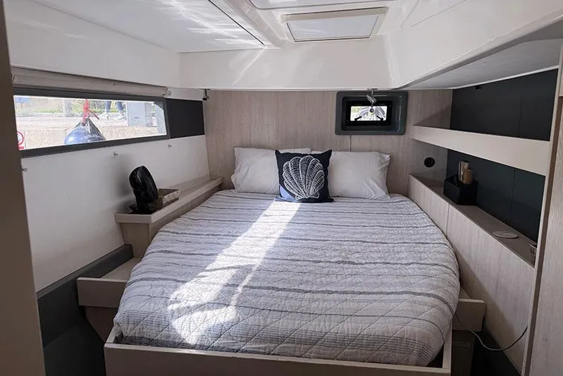  Yacht Photos Pics Luxurious bedroom interior of 2017 Leopard 48 yacht with cozy bedding and modern design.