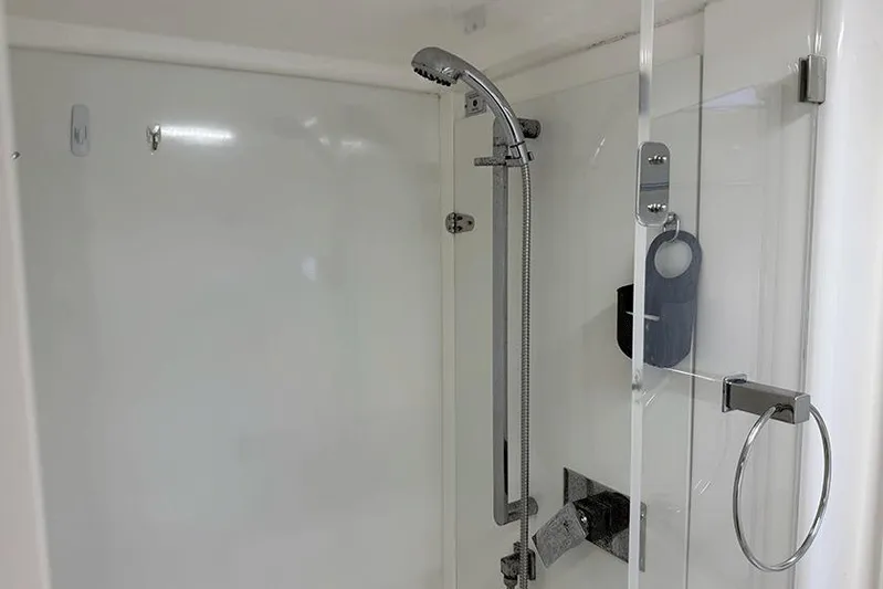  Yacht Photos Pics Modern shower in 2017 Leopard 48 yacht, featuring sleek chrome fixtures and glass door.