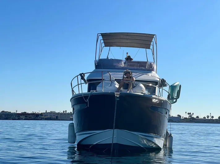 Tortuga Yacht Photos Pics 2017 Jeanneau Velasco 43F yacht on calm water under clear blue sky.