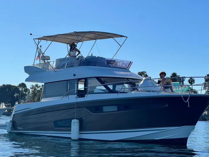 Tortuga Yacht Photos Pics 2017 Jeanneau Velasco 43F yacht cruising on calm waters under clear blue sky.