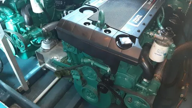  Yacht Photos Pics Engine room of a 2004 Cranchi Atlantique 40 yacht, showcasing mechanical components.