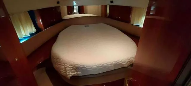  Yacht Photos Pics Luxurious cabin interior of 2004 Cranchi Atlantique 40 yacht with cozy bed.