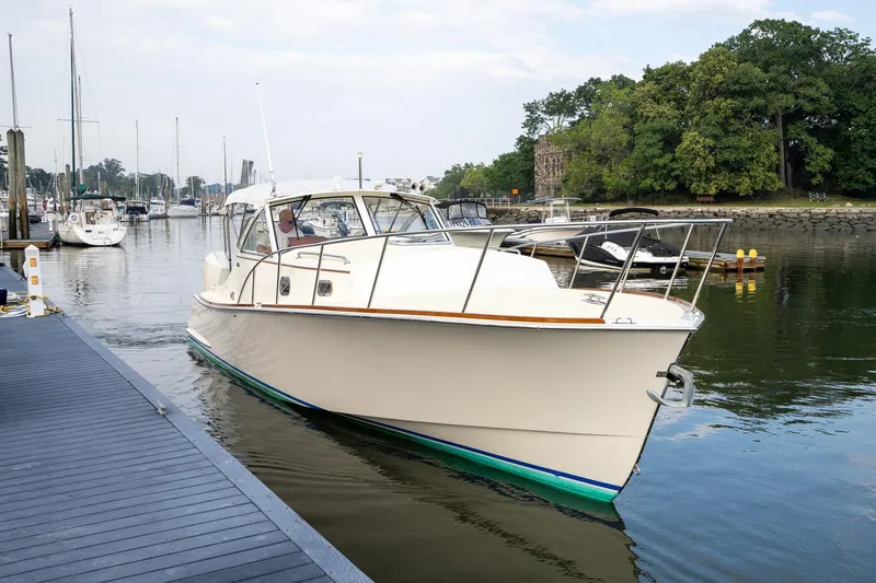 Marcy Yacht Photos Pics 2021 Brooklin Boat Yard 32 Express cruising near marina dock.