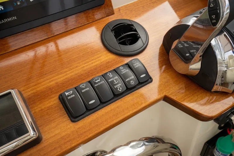 Marcy Yacht Photos Pics Control panel of 2021 Brooklin Boat Yard 32 Express with switches and throttle lever.