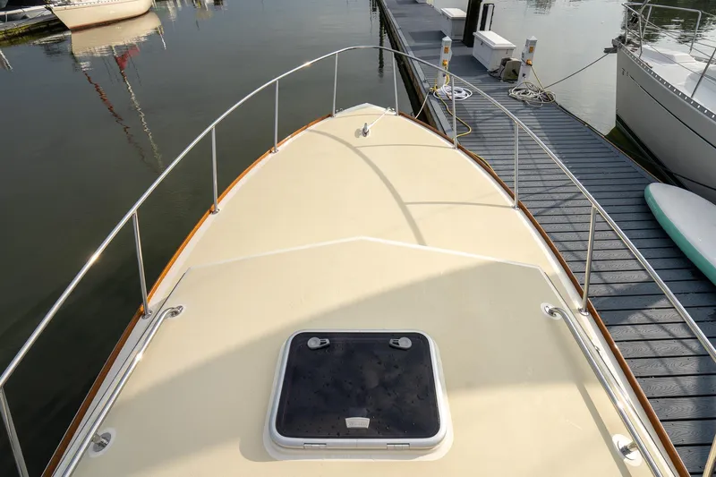 Marcy Yacht Photos Pics 2021 Brooklin Boat Yard 32 Express docked, showcasing deck and railing details.