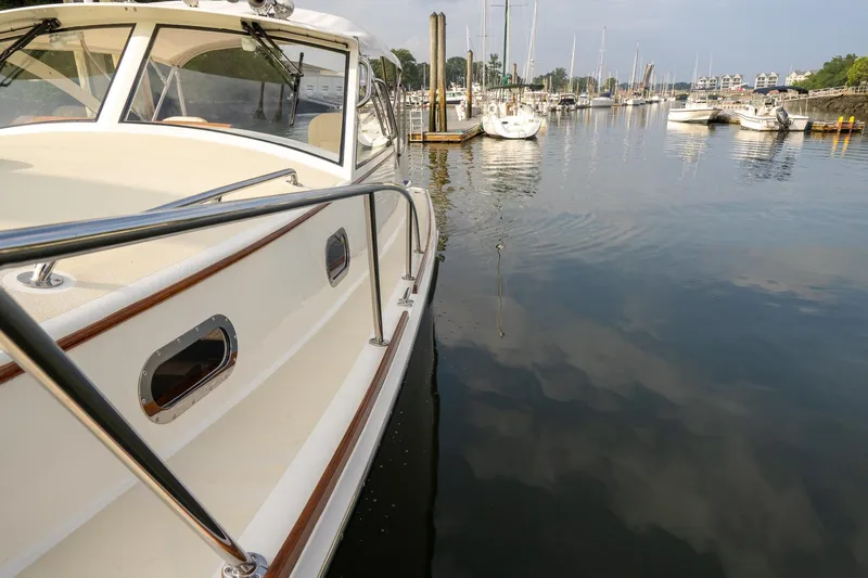 Marcy Yacht Photos Pics Brooklin Boat Yard 32 Express 2021 docked in a serene marina setting.