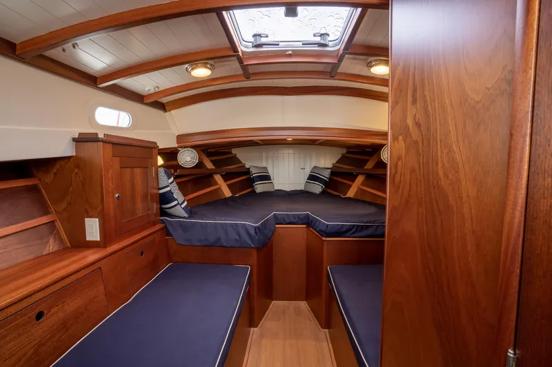Marcy Yacht Photos Pics Luxurious 2021 Brooklin Boat Yard 32 Express cabin with elegant wood finish and cozy seating.