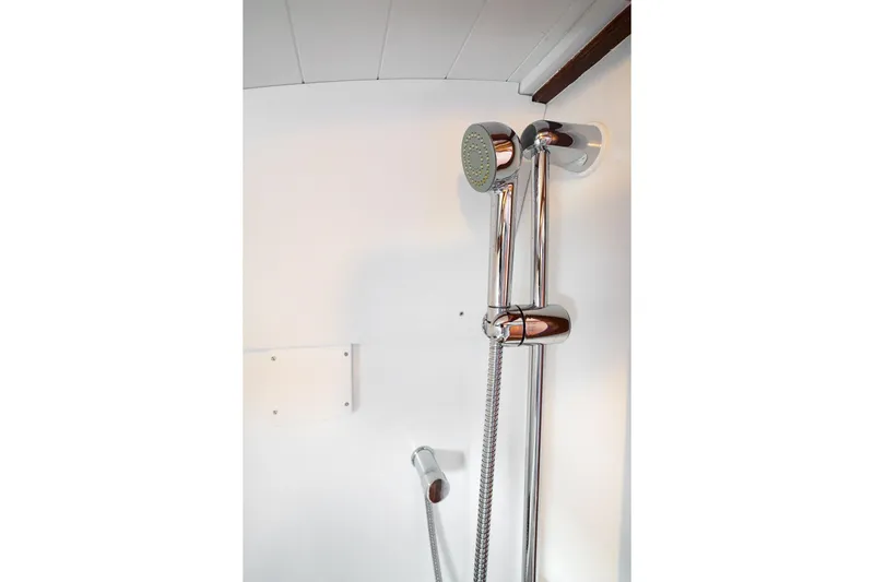 Marcy Yacht Photos Pics Shower area in 2021 Brooklin Boat Yard 32 Express, featuring chrome fixtures.
