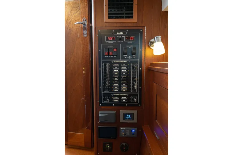 Marcy Yacht Photos Pics Electrical control panel on 2021 Brooklin Boat Yard 32 Express, featuring switches and gauges.