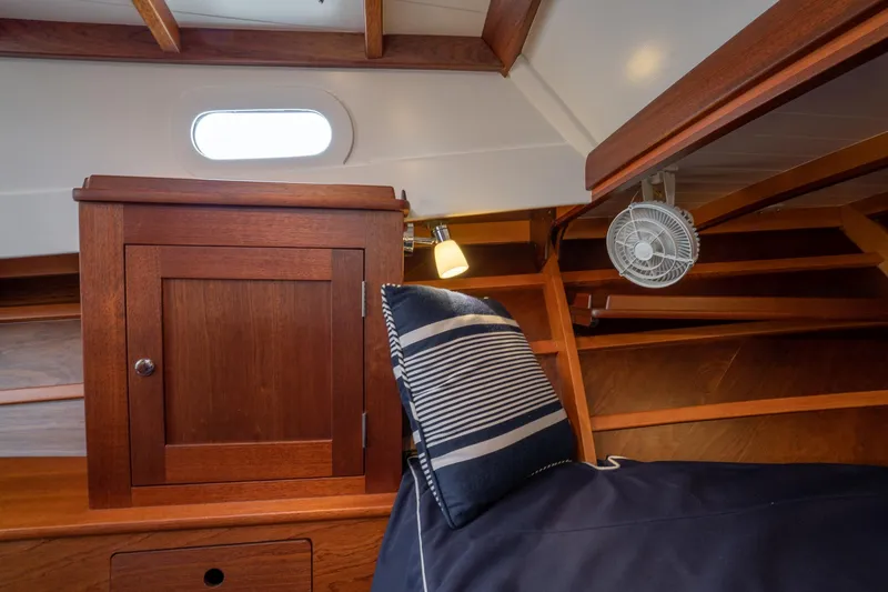 Marcy Yacht Photos Pics Interior of 2021 Brooklin Boat Yard 32 Express, featuring wooden cabinetry and nautical decor.
