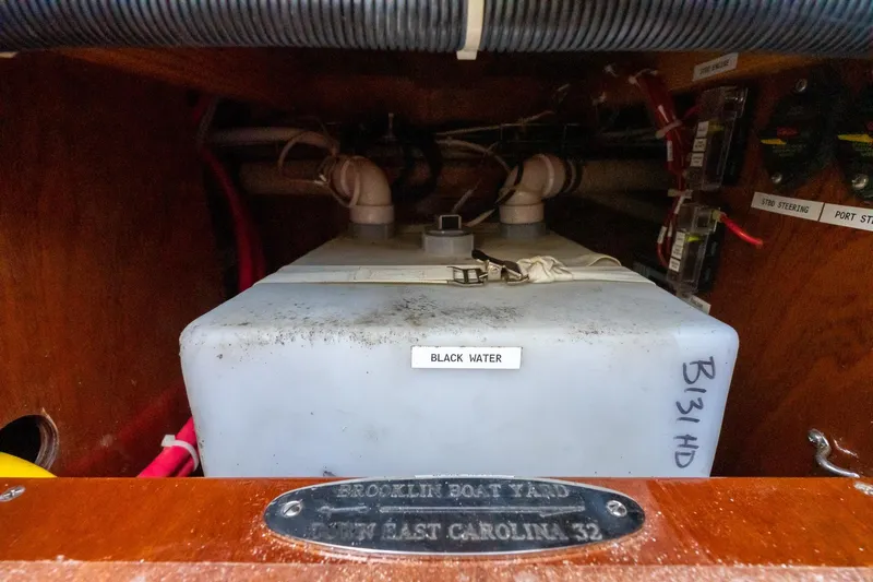 Marcy Yacht Photos Pics 2021 Brooklin Boat Yard 32 Express black water tank in wooden compartment.