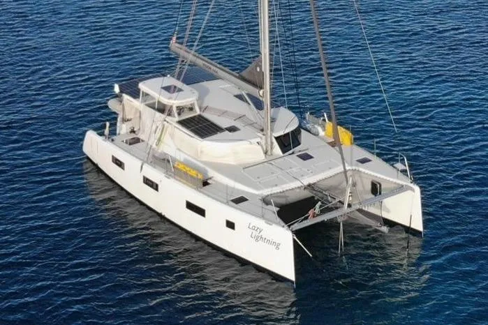 Lazy Lightning Yacht Photos Pics 2021 Vision 444 catamaran "Lazy Lightning" sailing on calm blue waters.