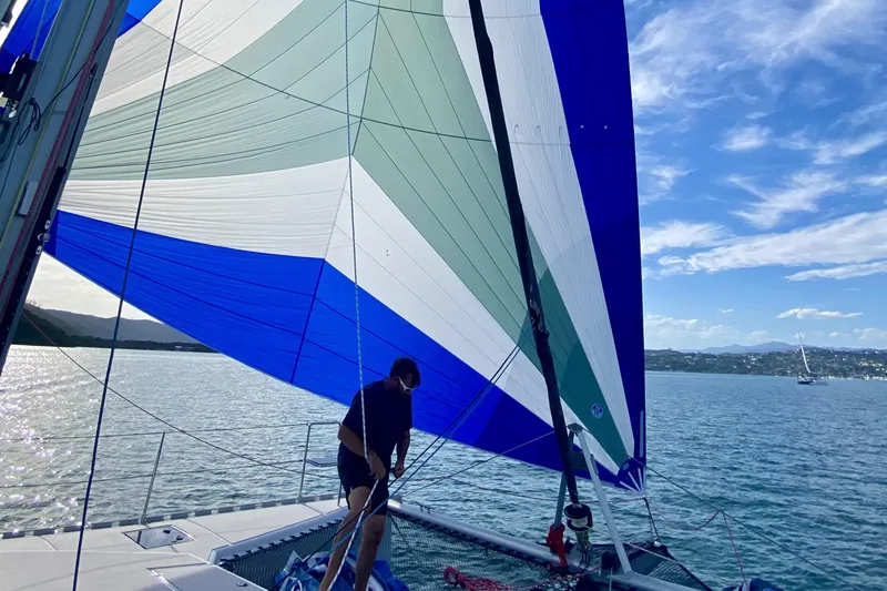 Lazy Lightning Yacht Photos Pics Sailboat with colorful sail on calm water, Vision 444 model, 2021.