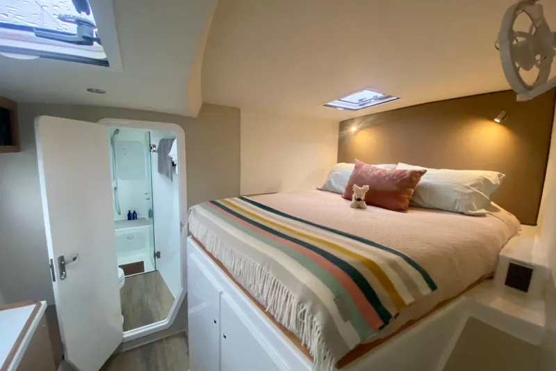 Lazy Lightning Yacht Photos Pics Cozy bedroom in 2021 Vision 444 yacht with ensuite bathroom and skylight.