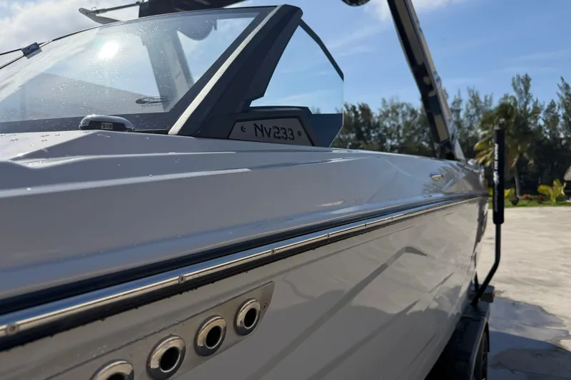  Yacht Photos Pics 2026 Centurion Nv233 boat, sleek design, close-up view, sunny day, outdoor setting.