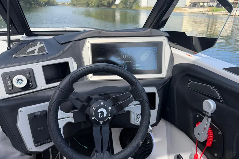  Yacht Photos Pics Interior of 2026 Centurion Nv233 boat with modern steering and digital display.