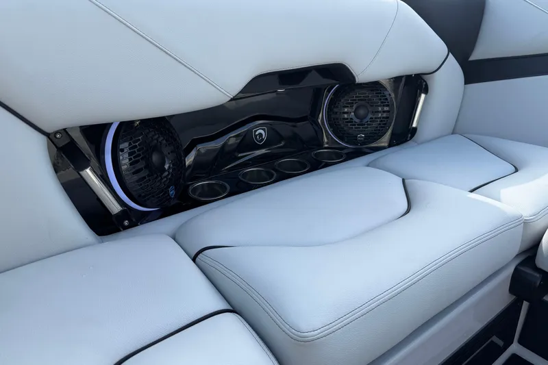  Yacht Photos Pics 2026 Centurion Nv233 interior with sleek white seating and integrated speakers.