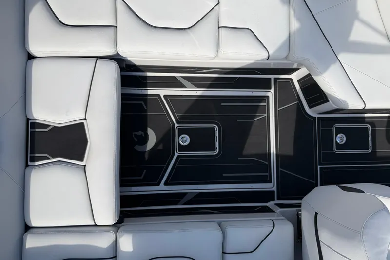  Yacht Photos Pics Interior view of 2026 Centurion Nv233 boat with sleek white seating and modern design.