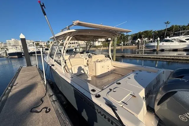  Yacht Photos Pics 2016 Grady-White Freedom 307 boat docked at marina under clear blue sky.