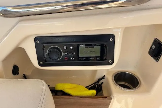  Yacht Photos Pics 2016 Grady-White Freedom 307 boat console with Fusion stereo system and cup holder.